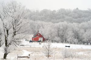 Red Barn in snow covered field