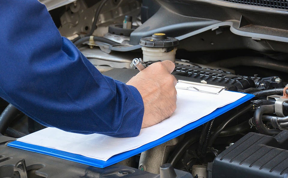 mechanic writing a note